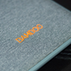 The back of all three devices is incased in a very pleasant fabric.